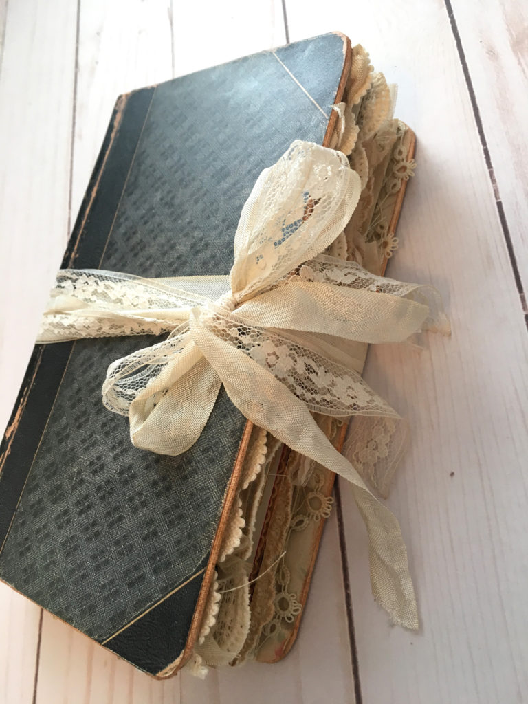 book with lace ribbon