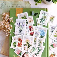 Faux floral postage stamps on green book