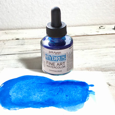 Ink bottle with blue ink splotch