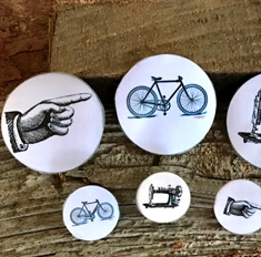Round pins with Hand, bicycle and sewing machine