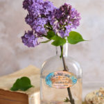 French blue labels on bottle with lilacs