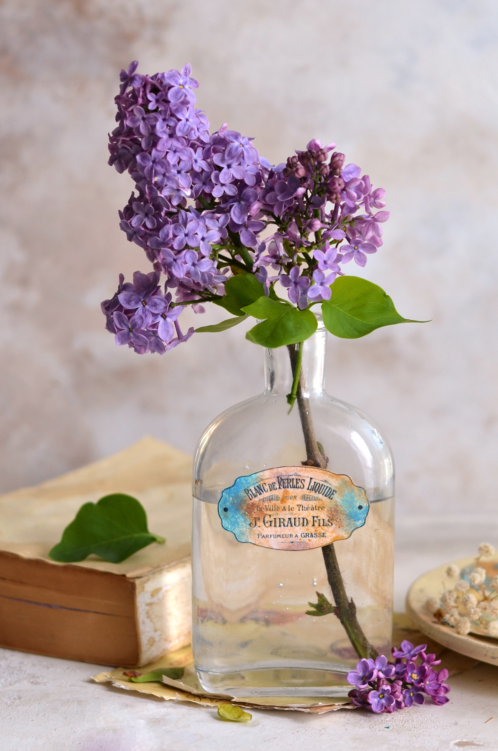 French blue labels on bottle with lilacs