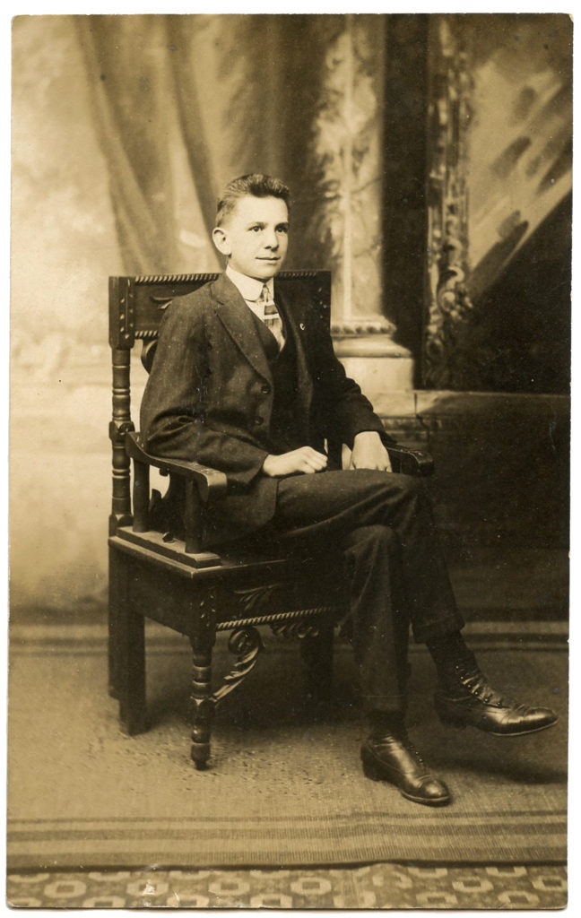 vintage man sitting chair photo image