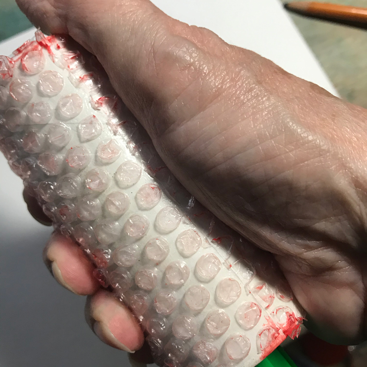 hand holding bubble wrap