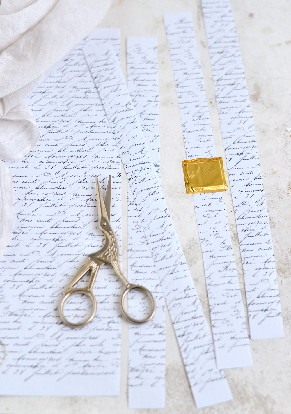 cutting script paper with scissors