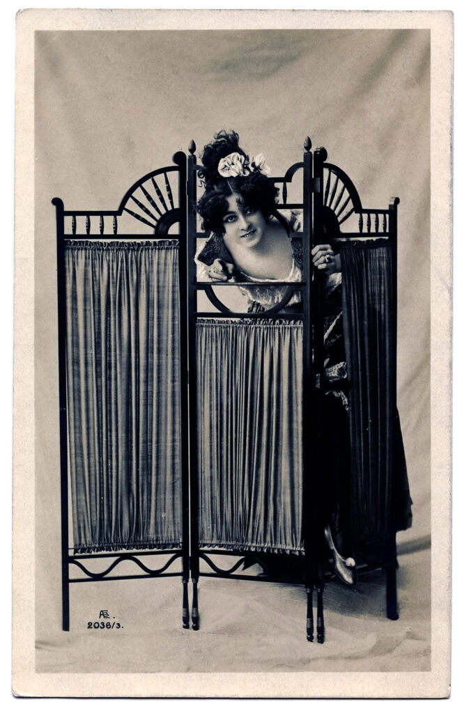 Photo of Actress peeking over Dressing Screen