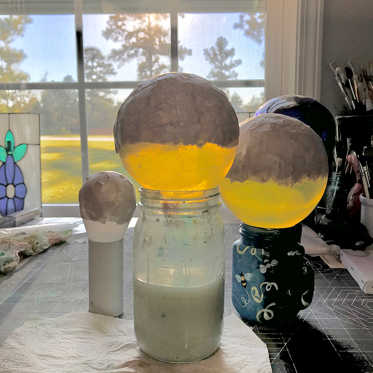 place balloon onto a jar to stabilize it while working and drying