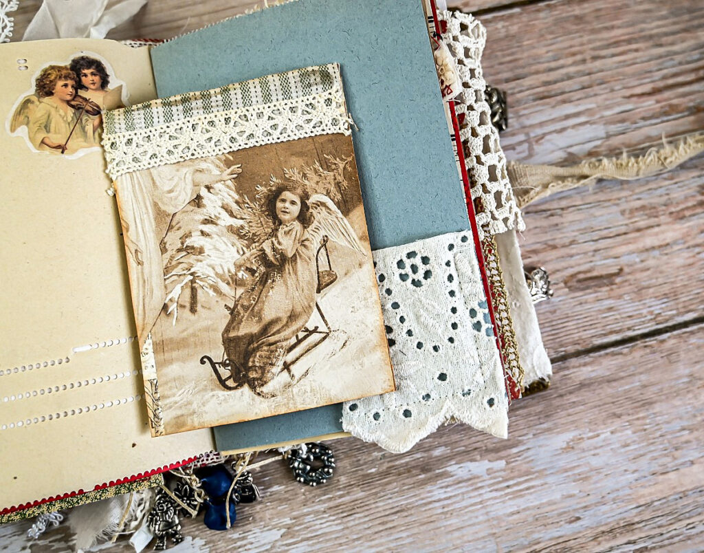 vintage photo girl sled angel wings lace embellished journal page