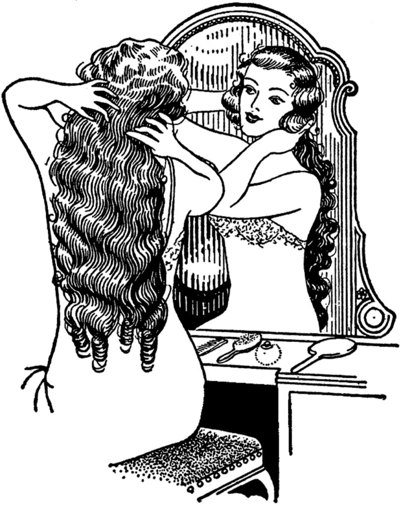 woman sitting at vanity table image