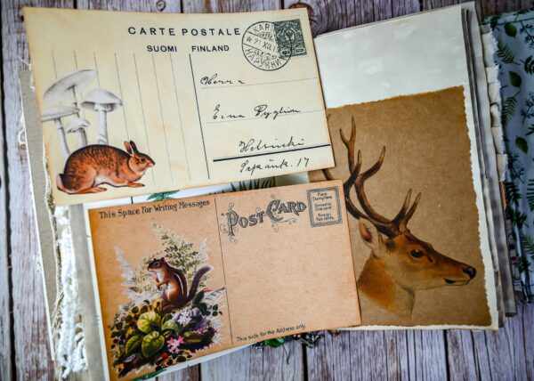 Junk journal spread with Vintage postcardsout