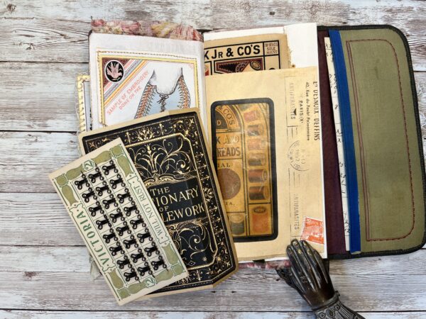 Junk journal spread with sewing ephemera
