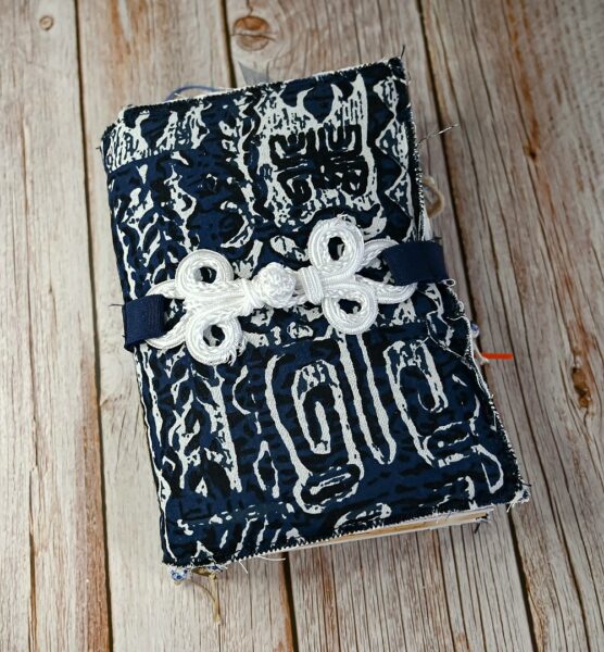 Junk journal cover with blue and white fabric