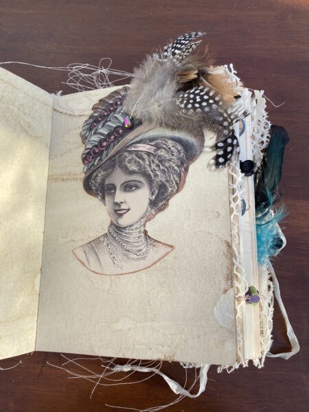 Junk journal spread with feathered hat