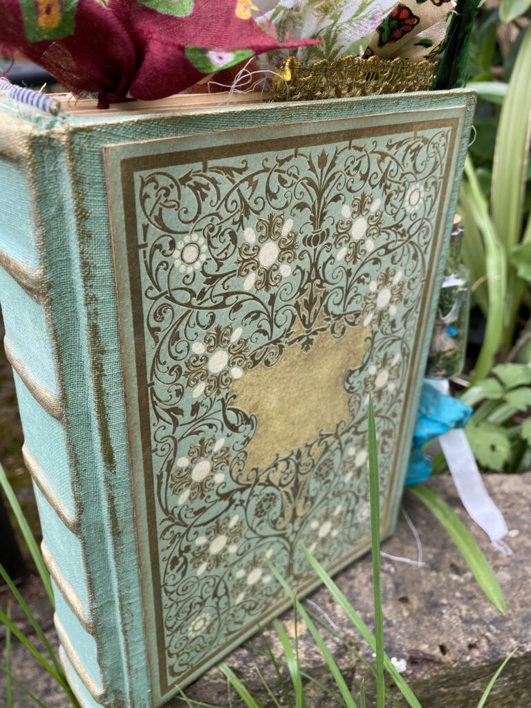 Junk journal cover with ribbons poking out