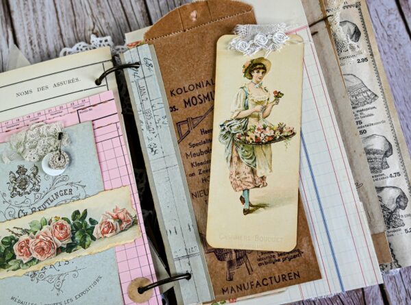 Junk journal spread with brown paper pocket