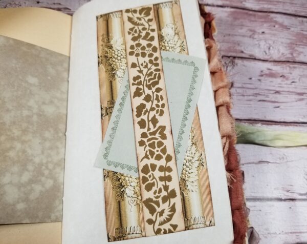 Junk journal spread with cream belly band