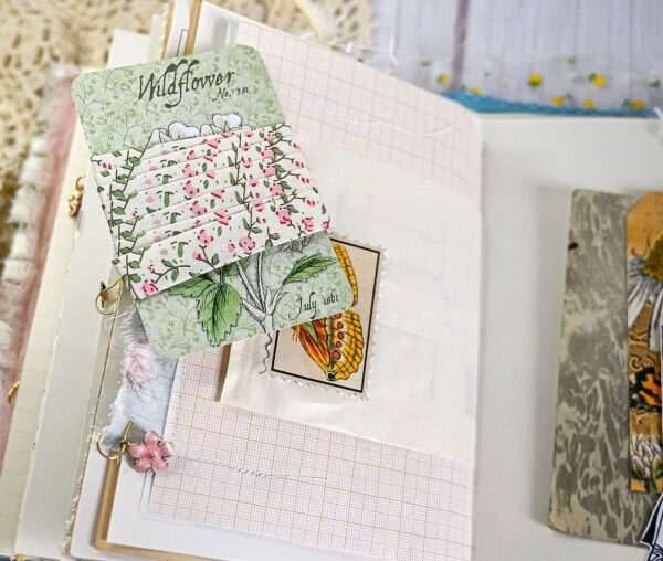 Junk journal spread with ribbon tag