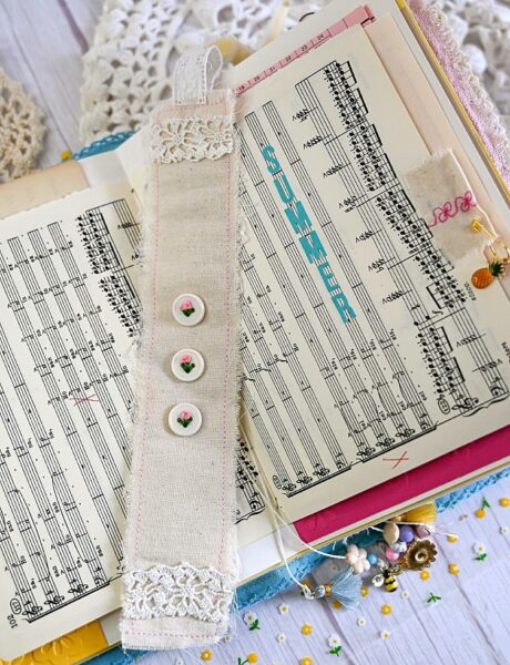 Junk journal spread with button book mark