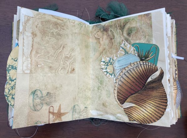 Junk journal spread with mermaid image