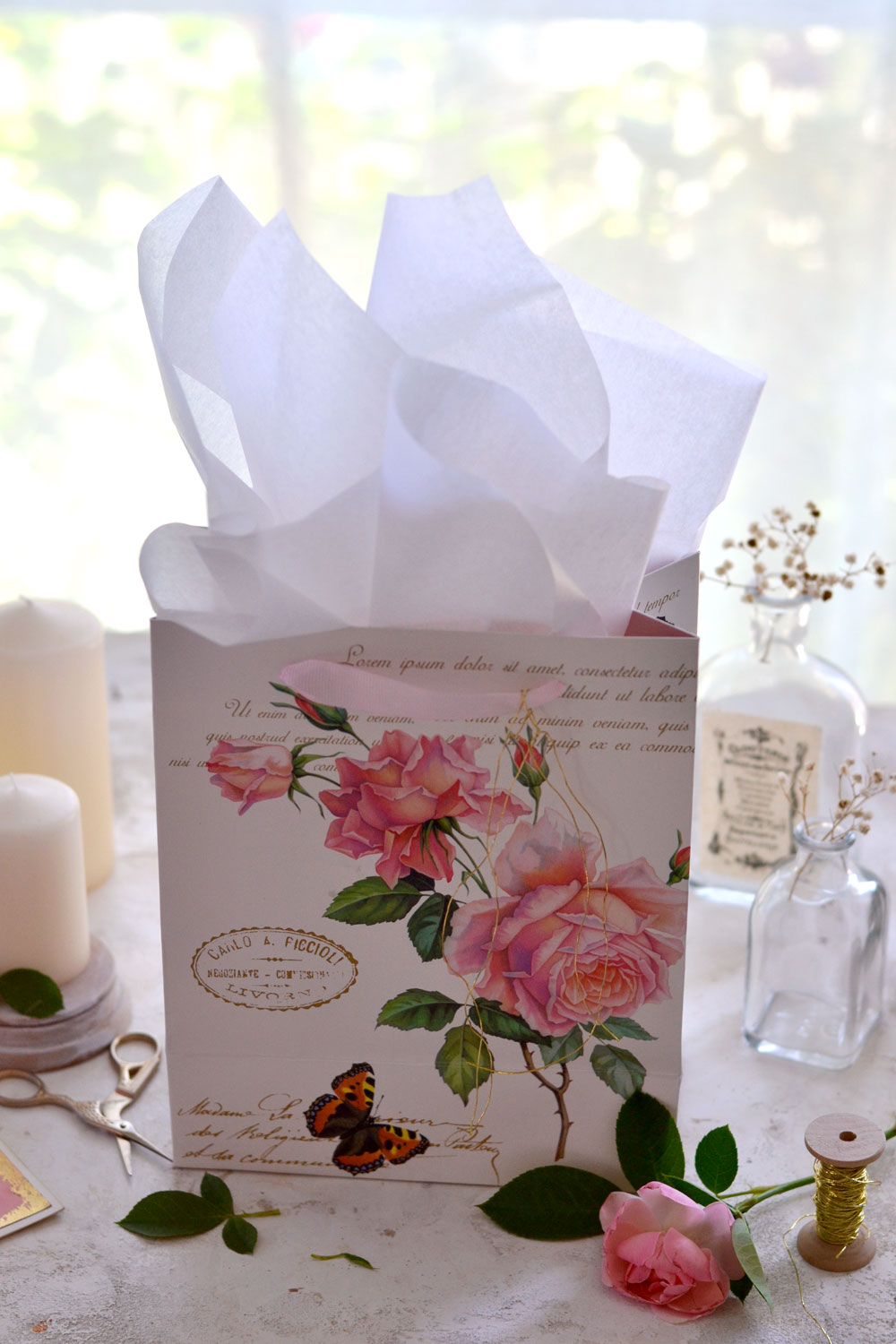 white tissue with pink rose bag