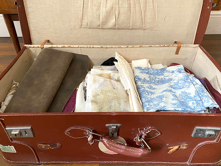 old suitcase stores fabrics