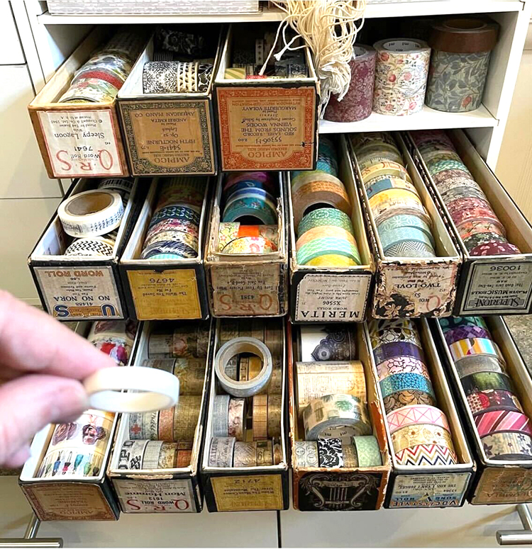 Washi Tape stored in old player piano roll boxes