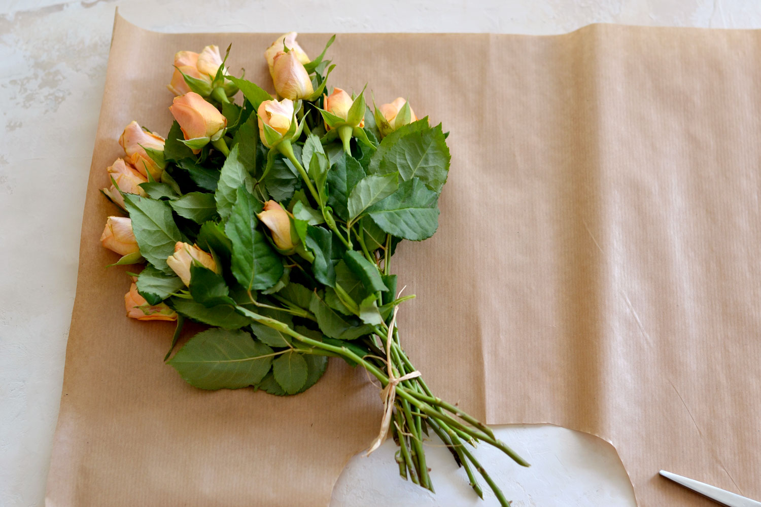 Bouquet Of Beautiful Dry Flowers Wrapped In Brown Paper Isolated