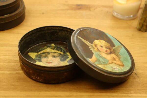 Tin with angel lid