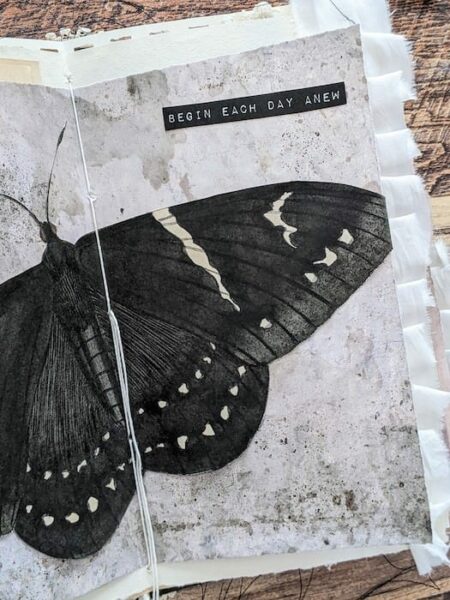 Junk journal spread with black butterfly