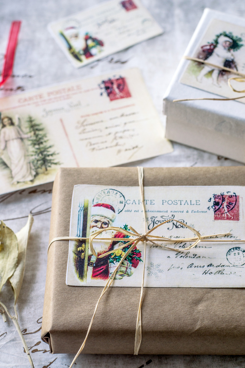 two gift boxes with vintage christmas postcards