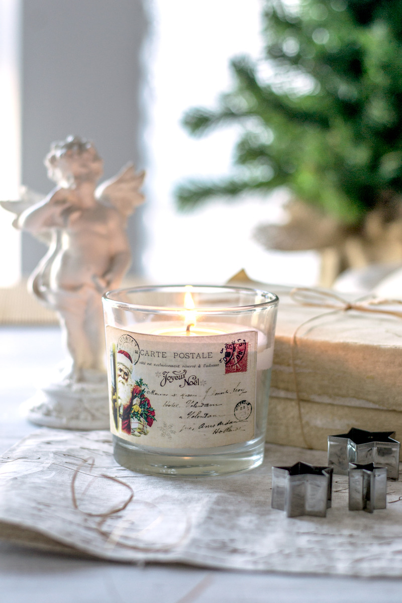 candle and angel with christmas postcard