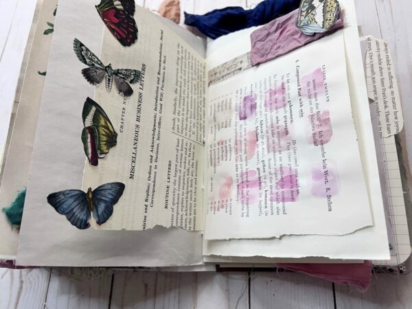 Junk journal spread with pink swatches and butterflies
