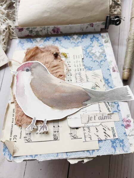 Layered journal page with bird painting