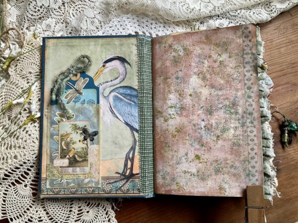 Inside cover of junk journal with heron image 