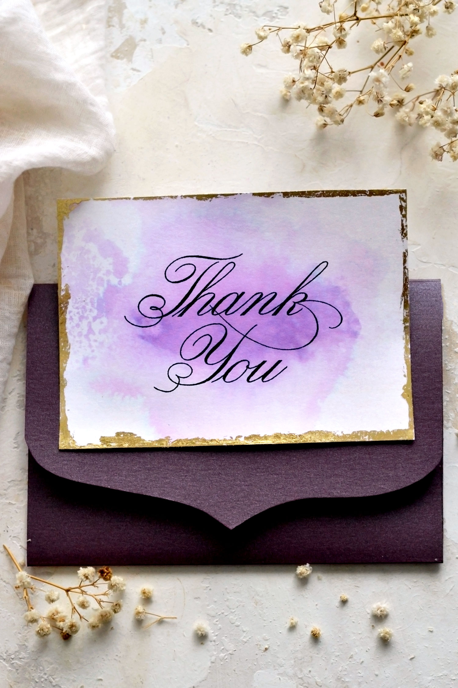 gold foil thank you card with purple envelope