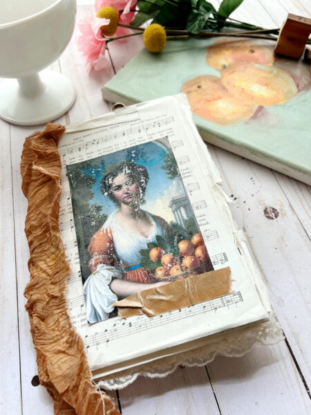 Journal spread with image of woman with oranges