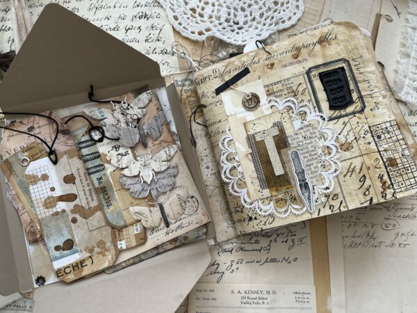 Collaged journal page with black and white butterfly motifs