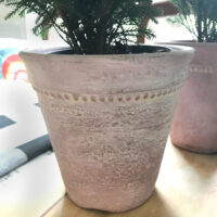 Pink terracotta pot with dabbed paint