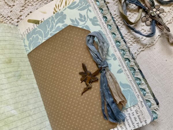 Journal page with metal charm attached