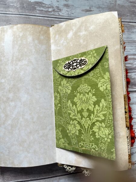 Green envelope on journal page