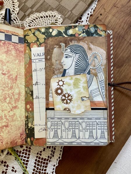 Pharaoh tag in a pocket on journal page