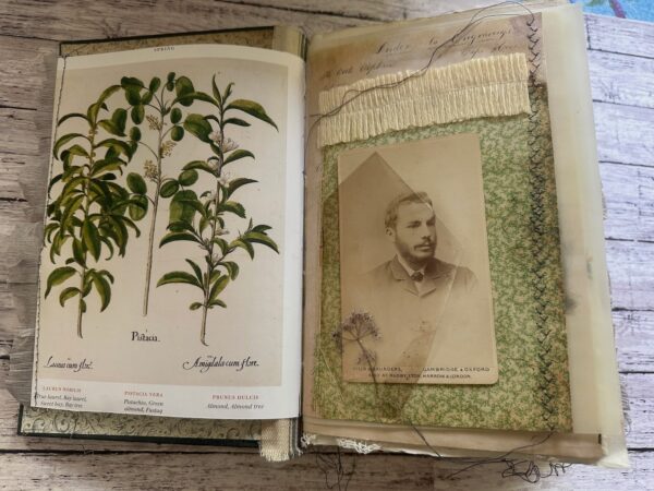 Journal spread with vintage photo and leaf print.