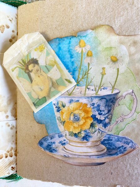 Tea cup and fairy image on journal page