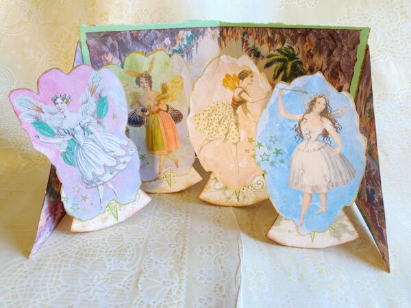 4 paper fairies on stands