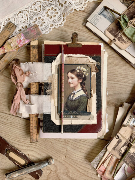 Journal cover with girl image and paintbrushes along the spine