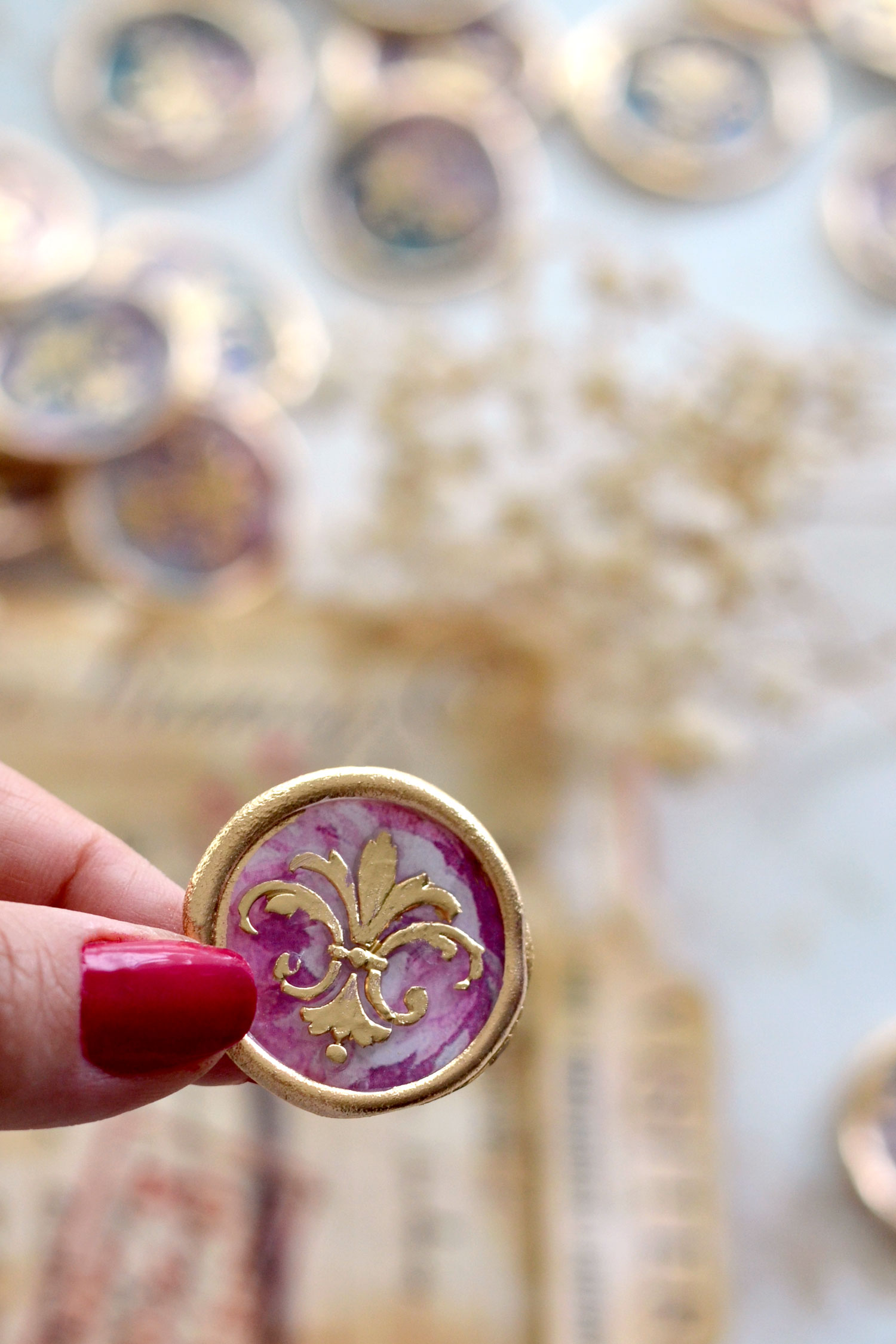 pink wax seal with gold touches