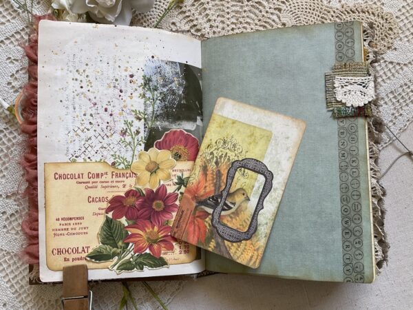 Journal spread with flowers and bird images