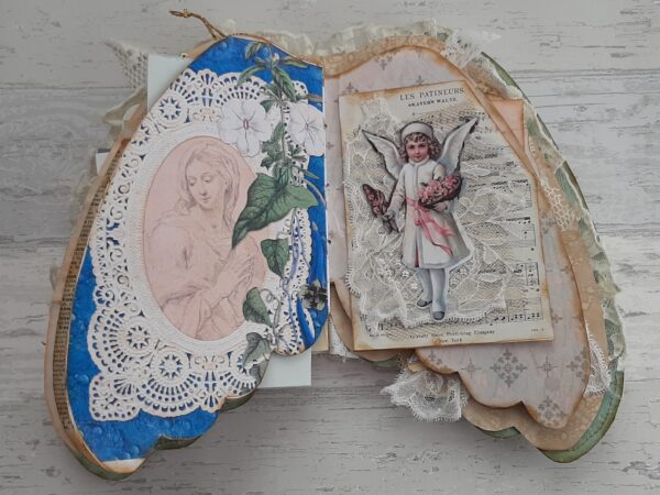 Journal spread with angel image and holy card