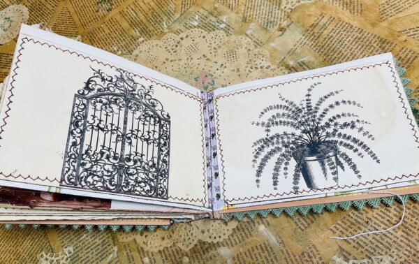 Journal spread with black and white plant and gate images