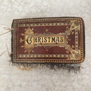 Brown journal cover with the word Christmas in gold